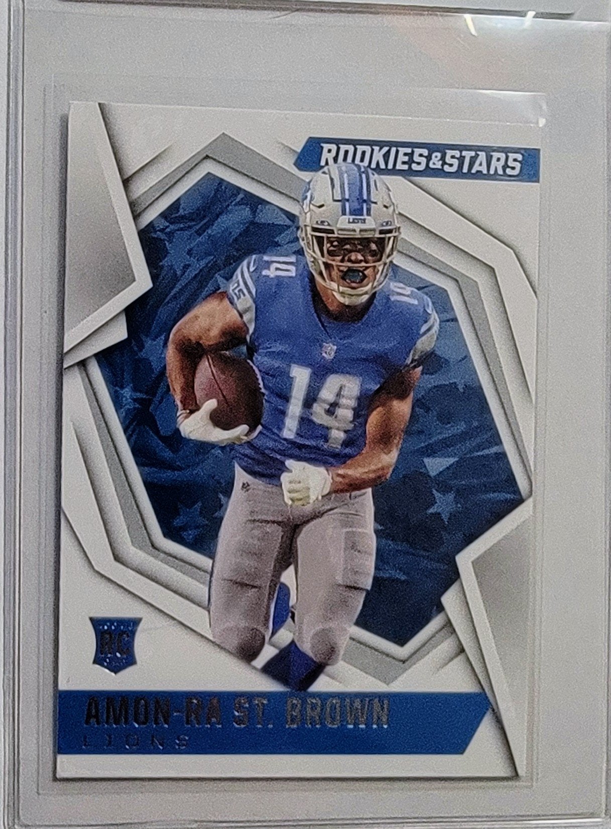 2021 Panini Rookies and Stars Aman Ra St. Brown Rookie Football Card AVM1 simple Xclusive Collectibles