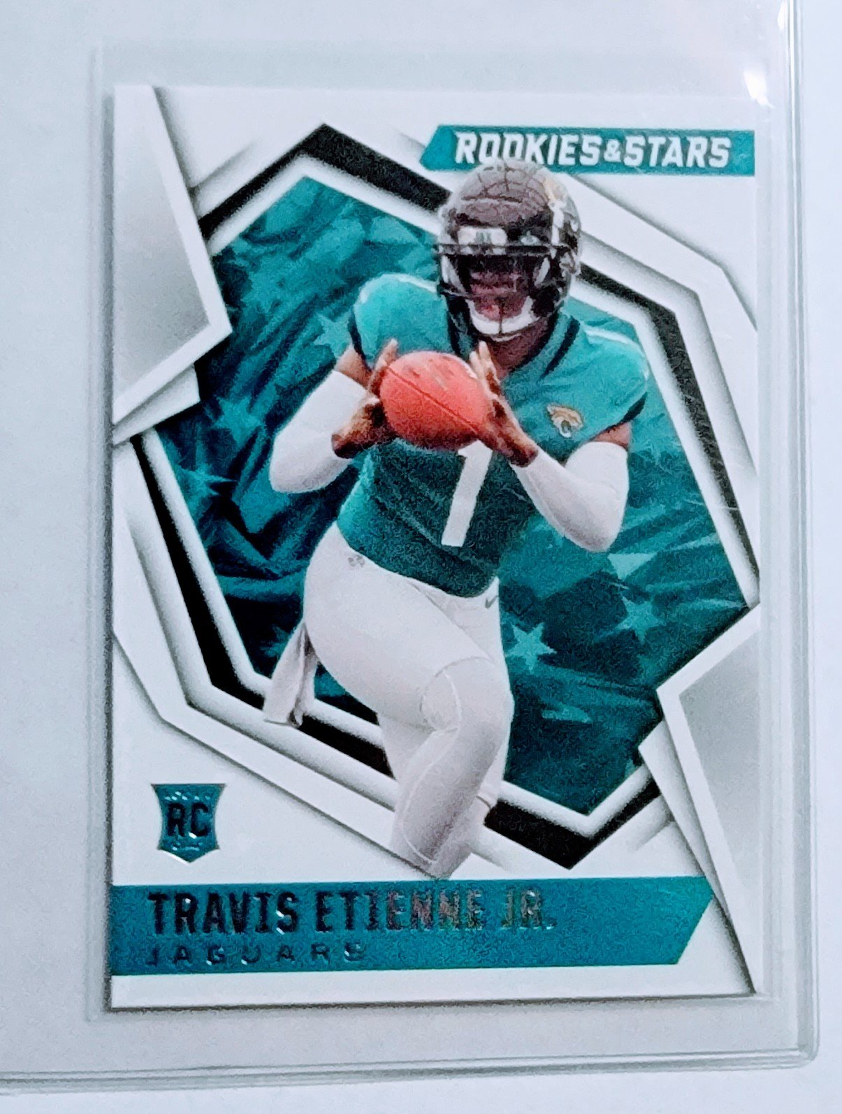 2021 Panini Rookies and Stars Travis Etienne Jr Rookie Football Card AVM1 simple Xclusive Collectibles   