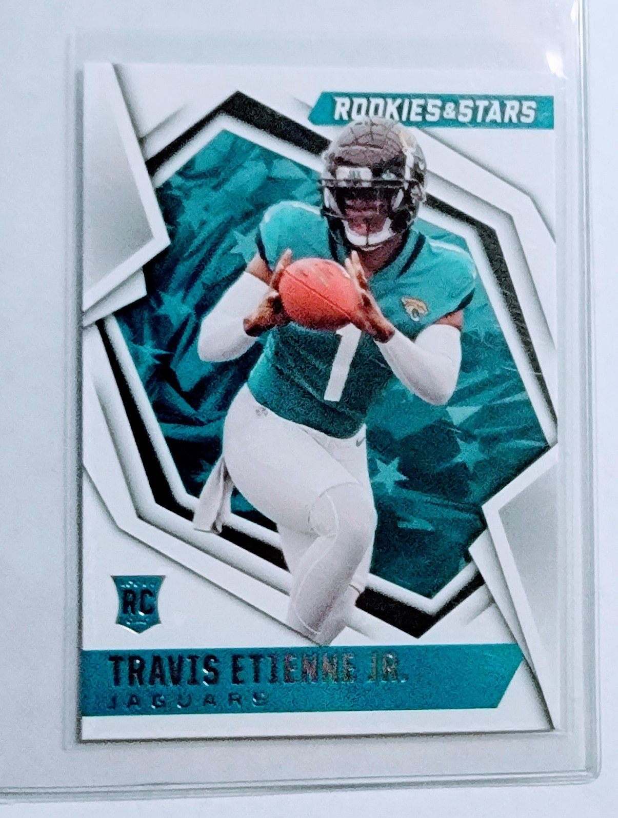 2021 Panini Rookies and Stars Travis Etienne Jr Rookie Football Card AVM1 simple Xclusive Collectibles