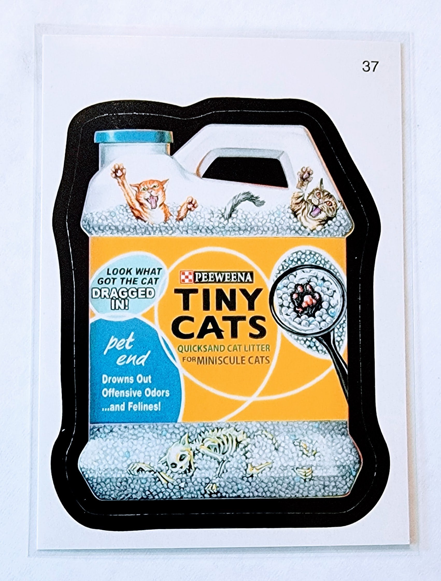 2010 Topps Wacky Packages All New Series 7 Tiny Cats Quicksand Cat Litter #37 Sticker Trading Card MCSC1 simple Xclusive Collectibles
