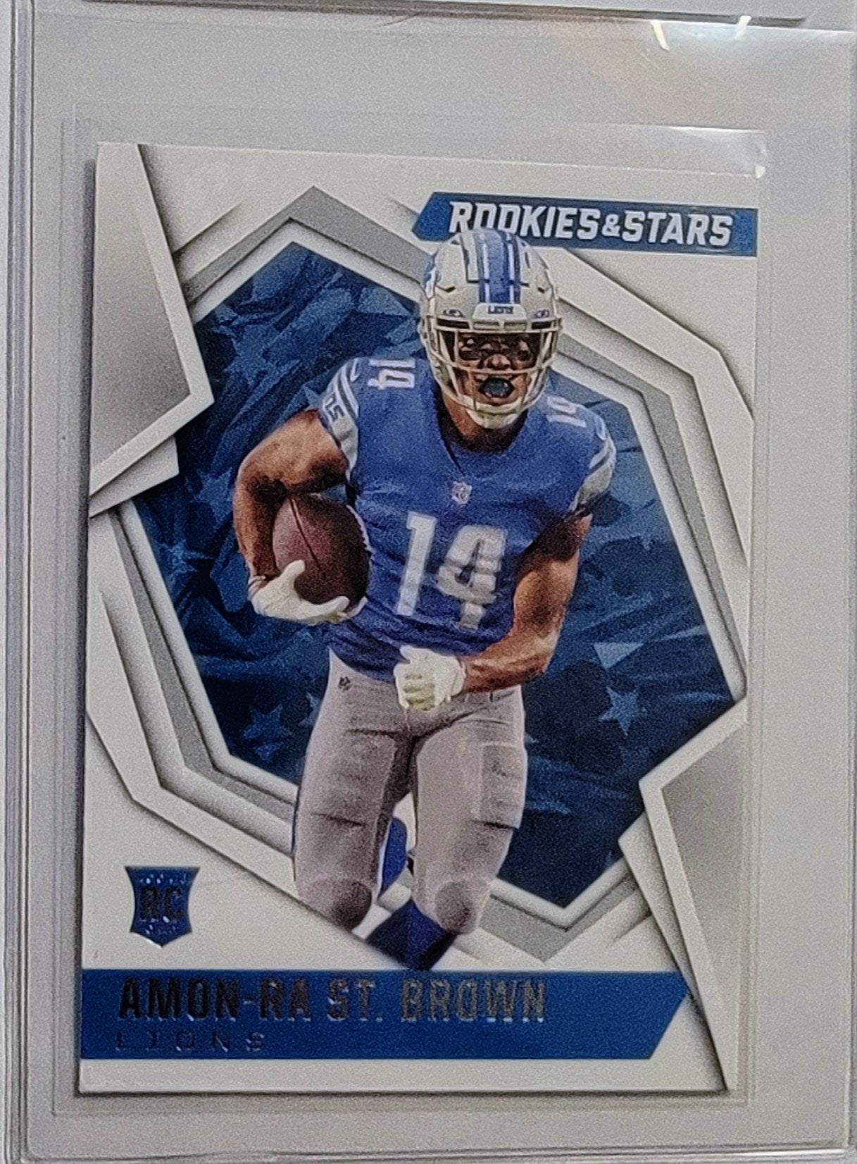 2021 Panini Rookies and Stars Aman Ra St. Brown Rookie Football Card AVM1 simple Xclusive Collectibles   